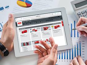 Project planning software Tablet displaying the product configurator interface and the hands of two people